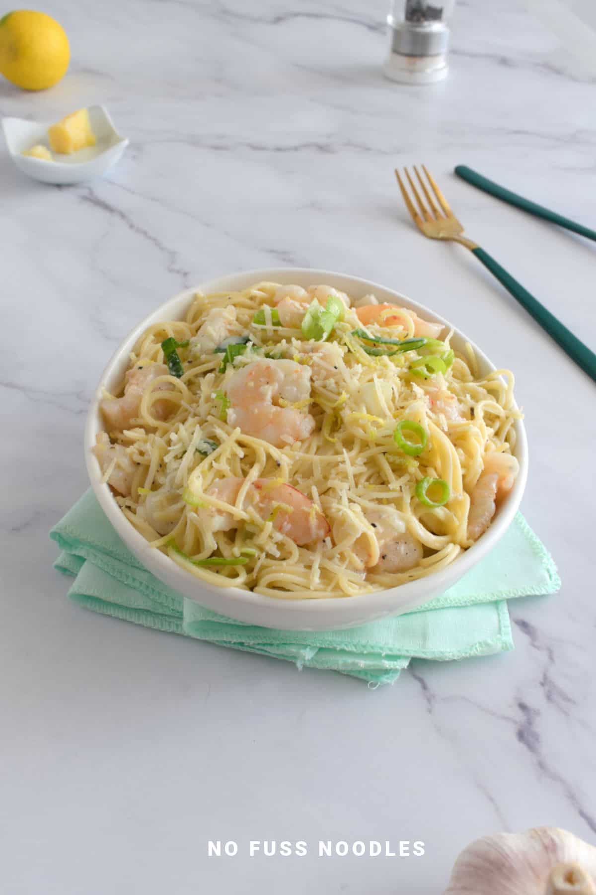 Pasta with shrimp in a bowl.