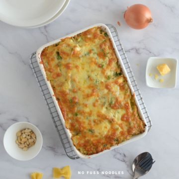 Close up image of pasta bake in a casserole dish.