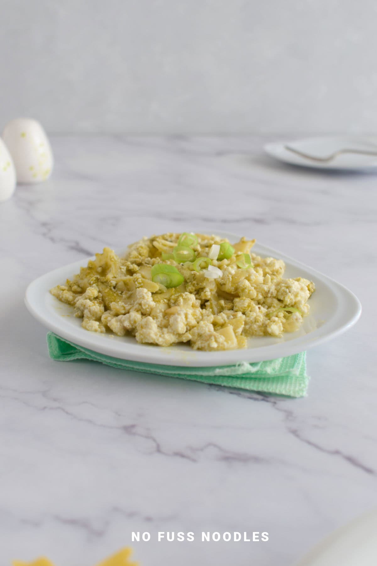 Ricotta pesto pasta in a plate.