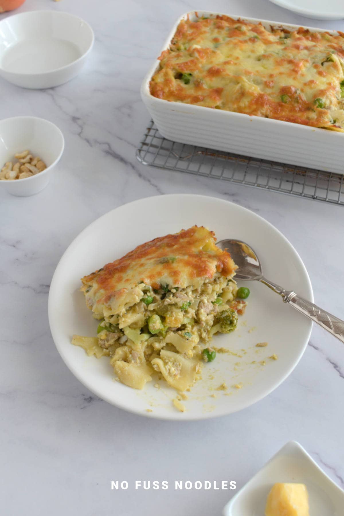 Ricotta pasta bake on a plate with a spoon.